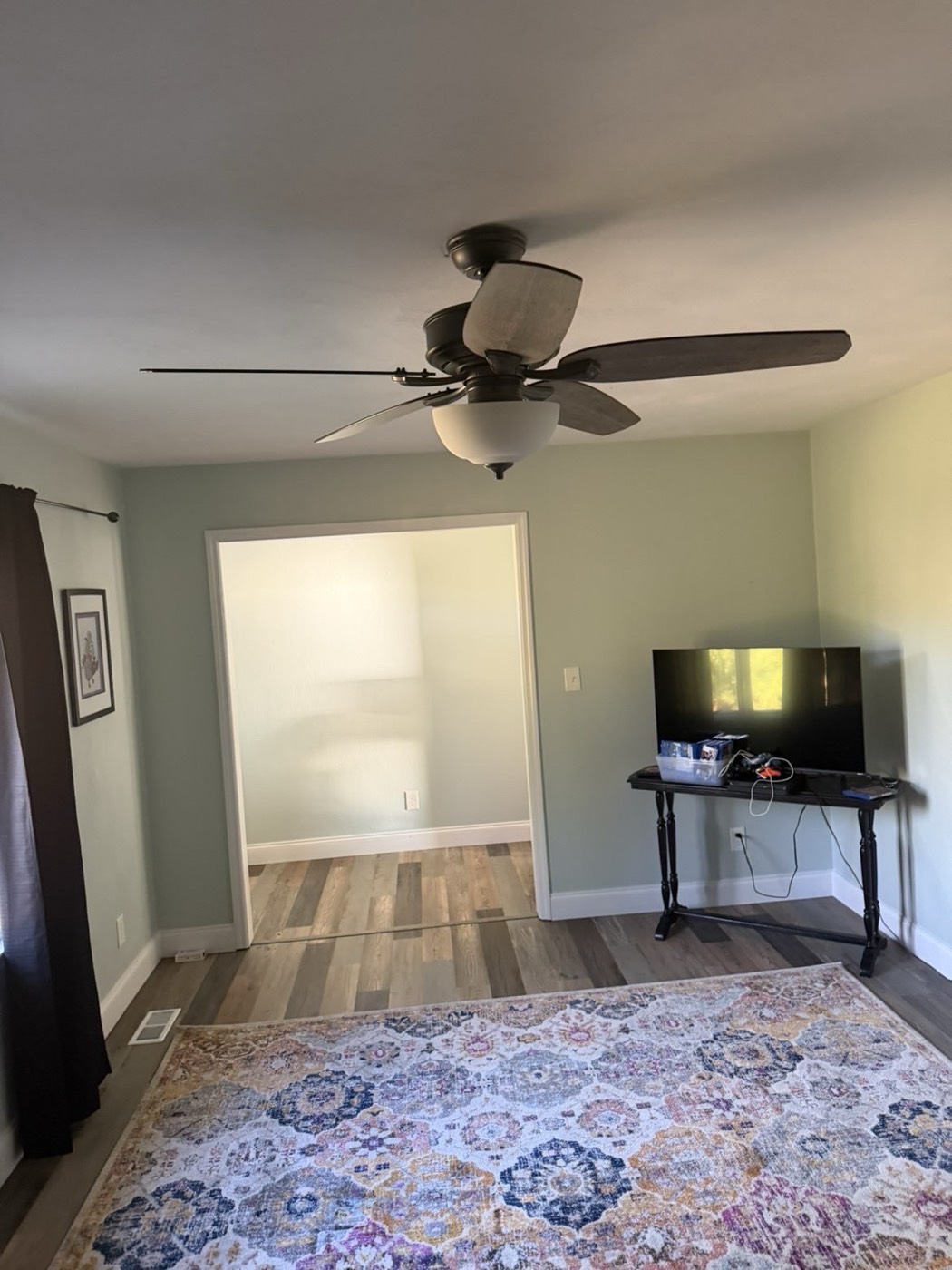 Living room after: furniture removed, floor clear